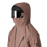The 686 Hydra Thermagraph jacket in brown has an insulated hood and a front zipper.