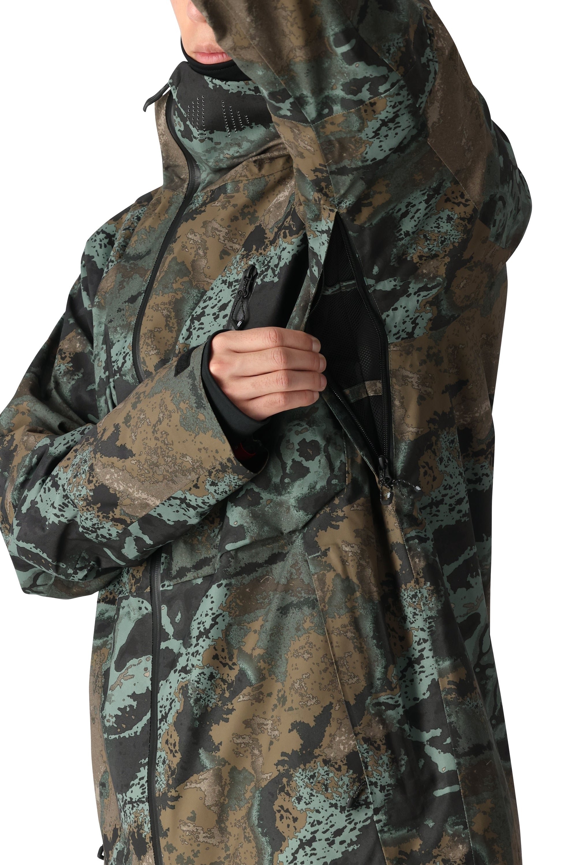 The 686 Hydra Thermagraph jacket in a brown and green camouflage pattern has an insulated hood.