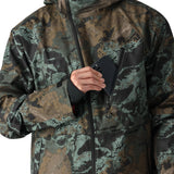 The 686 Hydra Thermagraph Jacket 2025 has a camouflage pattern with shades of green and brown on a black base.