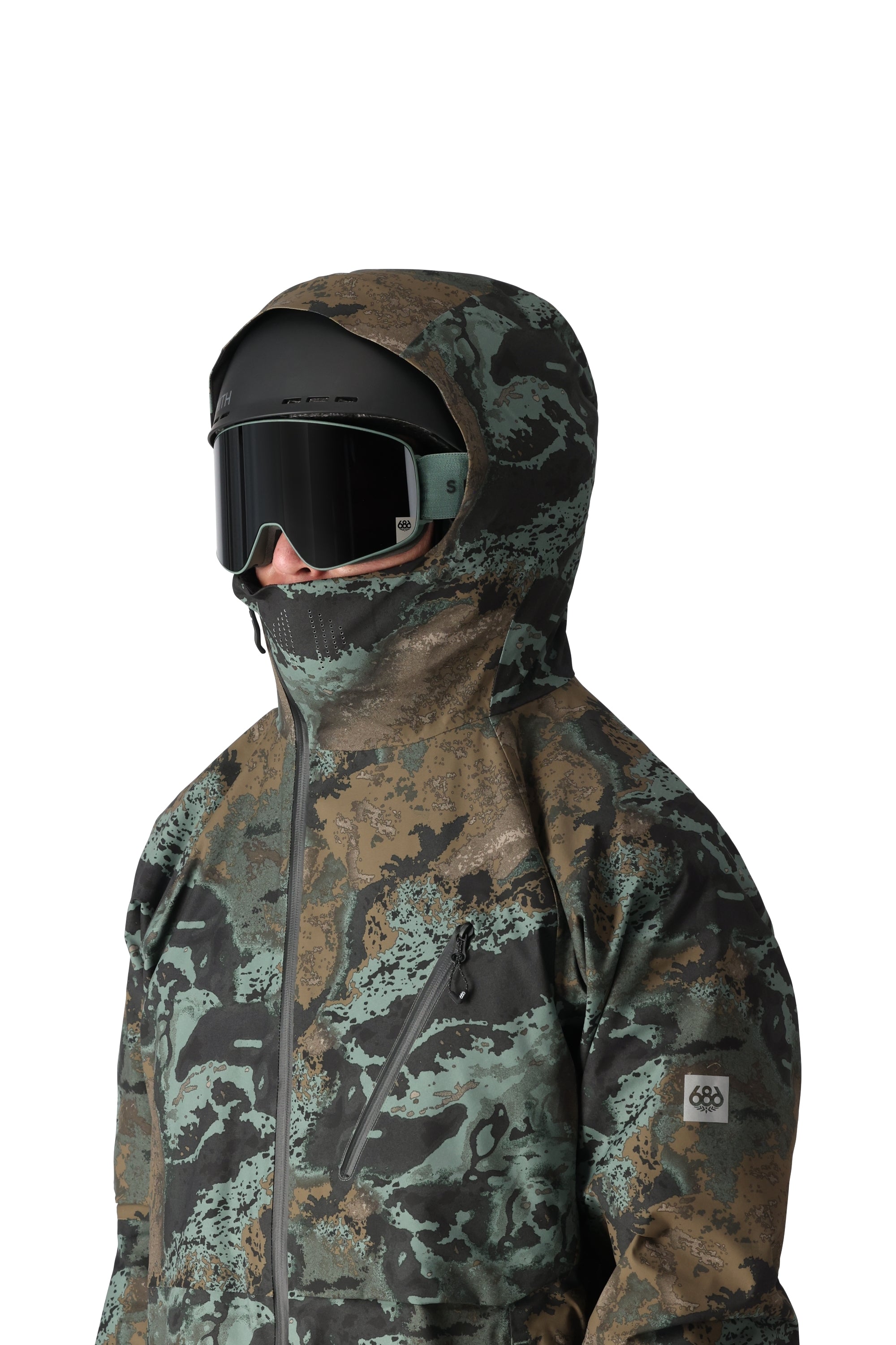 The 686 Hydra Thermagraph jacket appears to be black with a brown and green camouflage pattern.