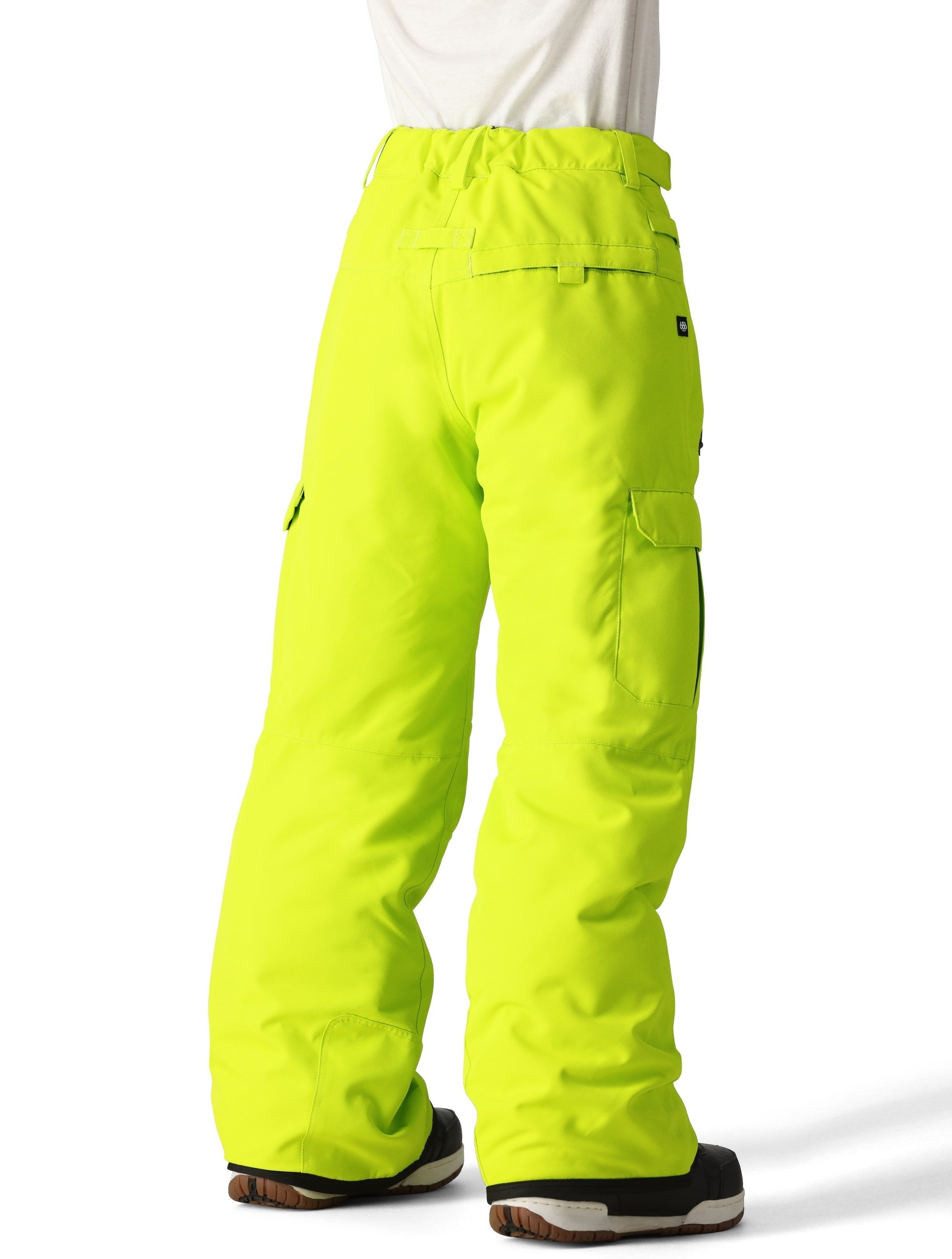 The 686 Boy's Infinity Cargo Insulated Pant 2025 is shown from the back in neon yellow with cargo pockets on each thigh and a drawstring waist.