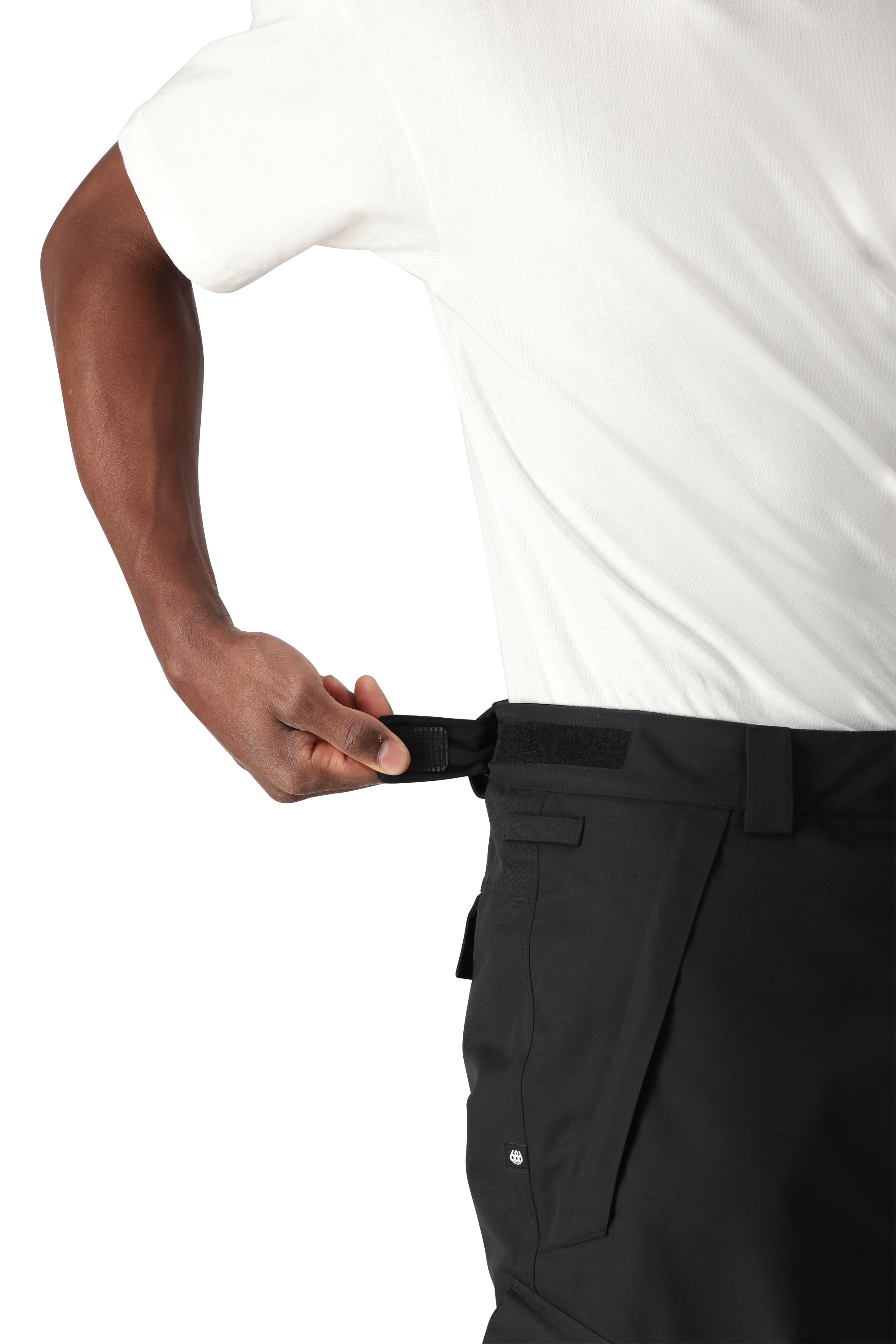 The 686 Men's Infinity Insulated Cargo Pant 2025 is showcased in this side view, highlighting its black color and cargo pockets.