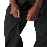 The 686 Men's Infinity Insulated Cargo Pant 2025 is shown in black with zippered pockets and cargo-style leg openings.