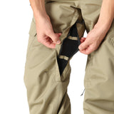 The 686 Men's Infinity Insulated Cargo Pant 2025 is shown in khaki with two zippered front pockets and a distinctive cargo pocket on each leg.