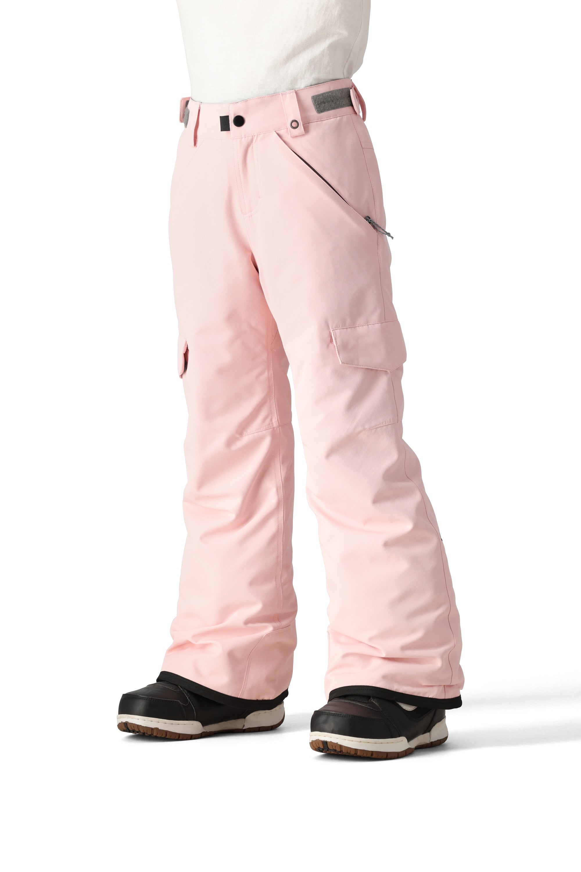 The 686 Girl's Lola Insulated Pant 2025 is light pink with a zippered pocket on the right thigh and an adjustable strap at the waist.