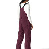 The 686 Women's Black Magic Insulated Bib features black suspenders and a bib leg with a visible zippered pocket on the side.