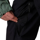 Men's black shell pants close-up of zip hand pocket with mesh lining