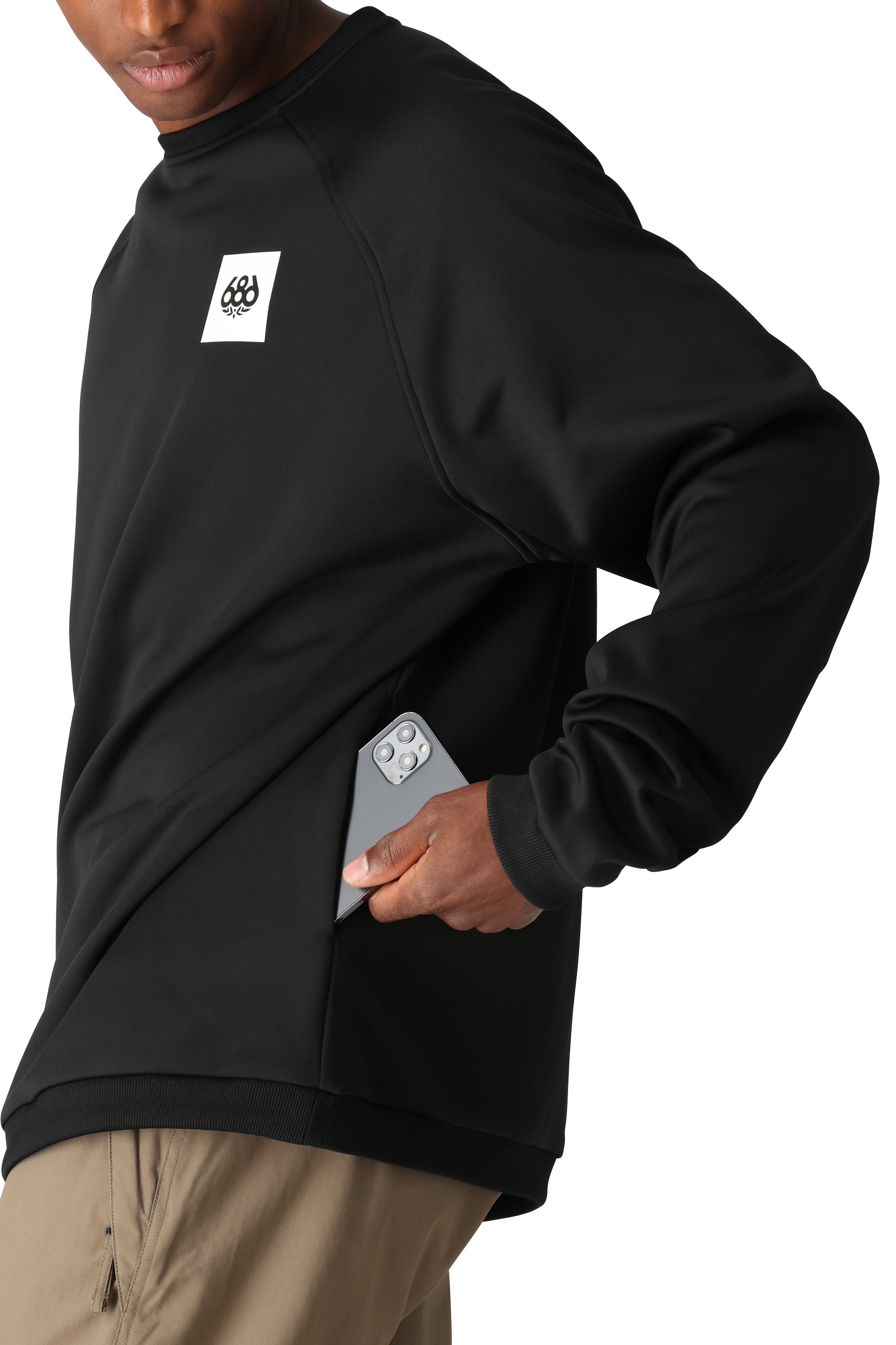 The 686 Men's Bonded Fleece Crew 2025 is primarily black with an off-white logo on the upper left chest and a ribbed crew neckline.