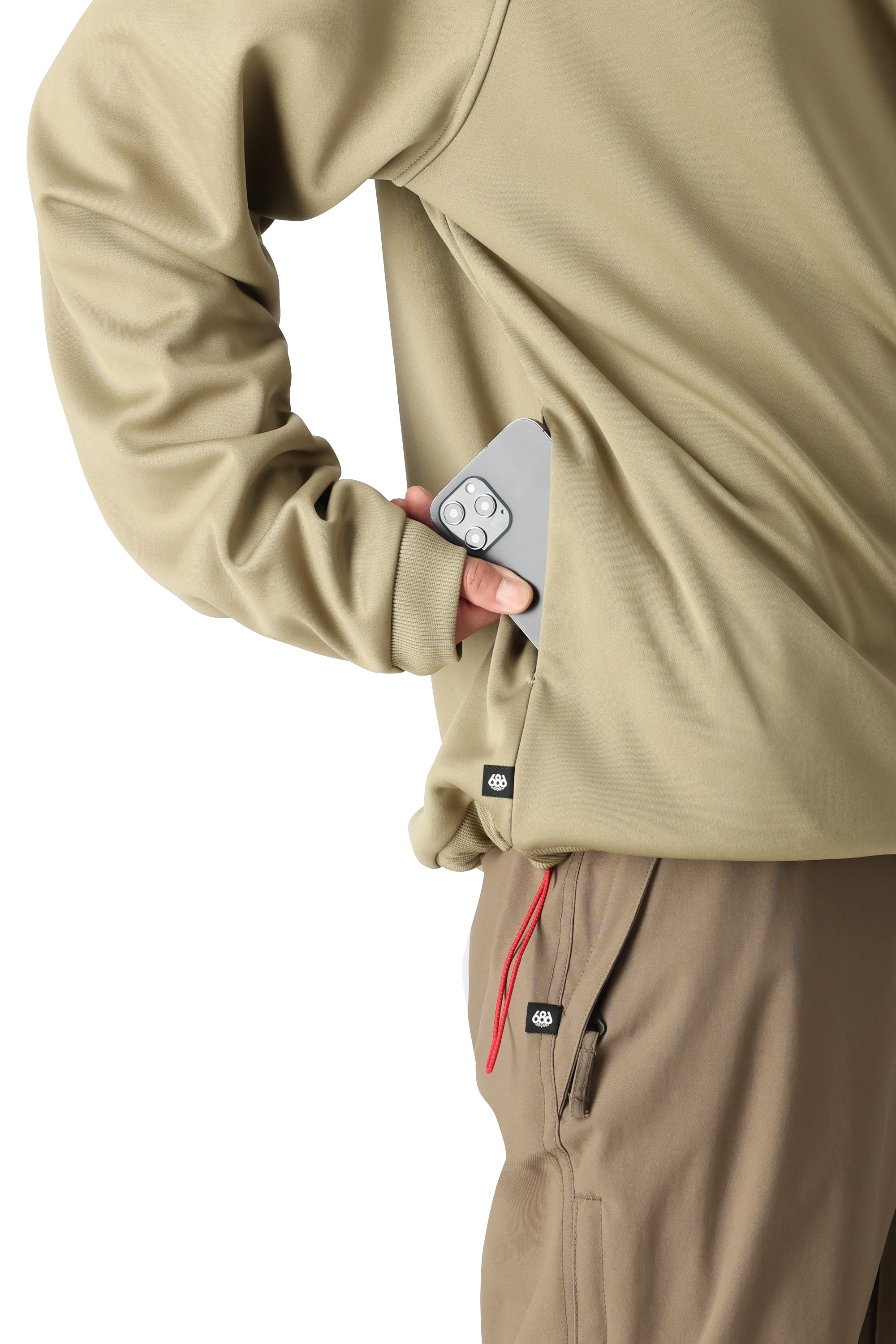 The 686 Men's Bonded Fleece Crew 2025 in this image appears to be khaki-colored with a black drawstring.