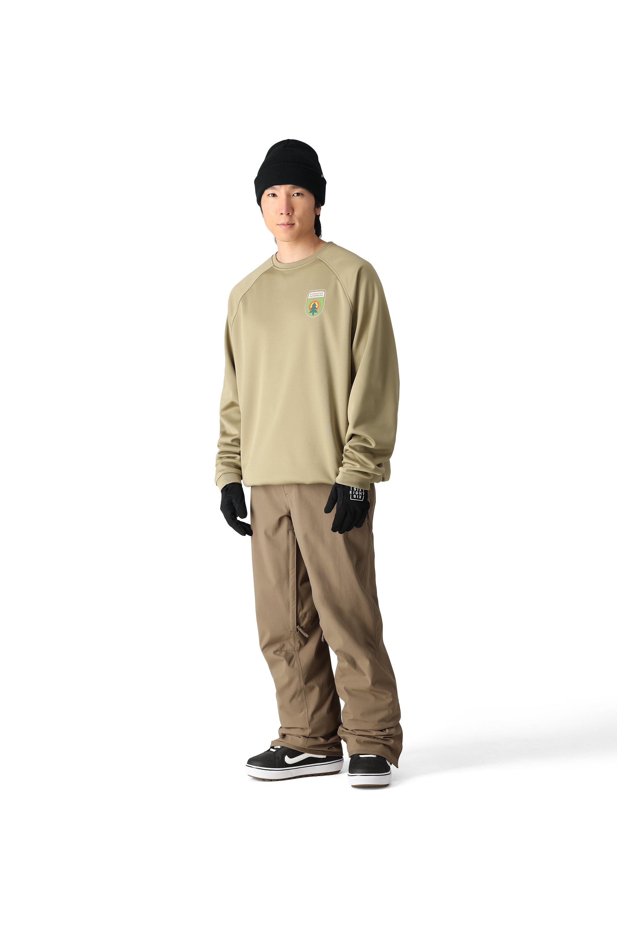 The 686 Men's Bonded Fleece Crew 2025 is pictured in a tan color with a crew neck and long sleeves.