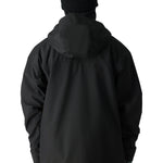 The 686 Gateway Shell Jacket 2025 in black has a large hood and zippered pockets on both sides.