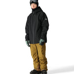 The 686 Gateway Shell Jacket 2025 is black with a high collar and zippered pockets.