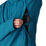 The 686 Gateway Shell Jacket 2025 is primarily blue with an insulated hood and multiple zippered pockets.