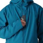 The 686 Gateway Shell Jacket 2025 is showcased in this image, featuring a rich blue color and an insulated hood.
