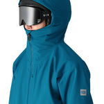 The 686 Gateway Shell Jacket 2025 is blue with an insulated hood and front zip closure.
