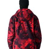 The 686 Gateway Shell Jacket 2025 has a striking red and black tie-dye pattern on its front view.