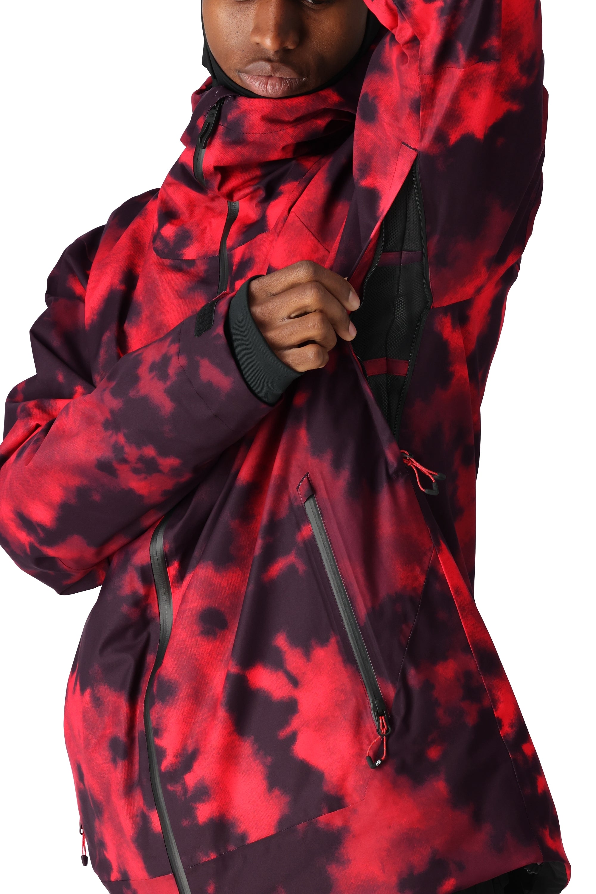 The 686 Gateway Shell Jacket 2025 in the image has a red and black color scheme with a bold pattern.