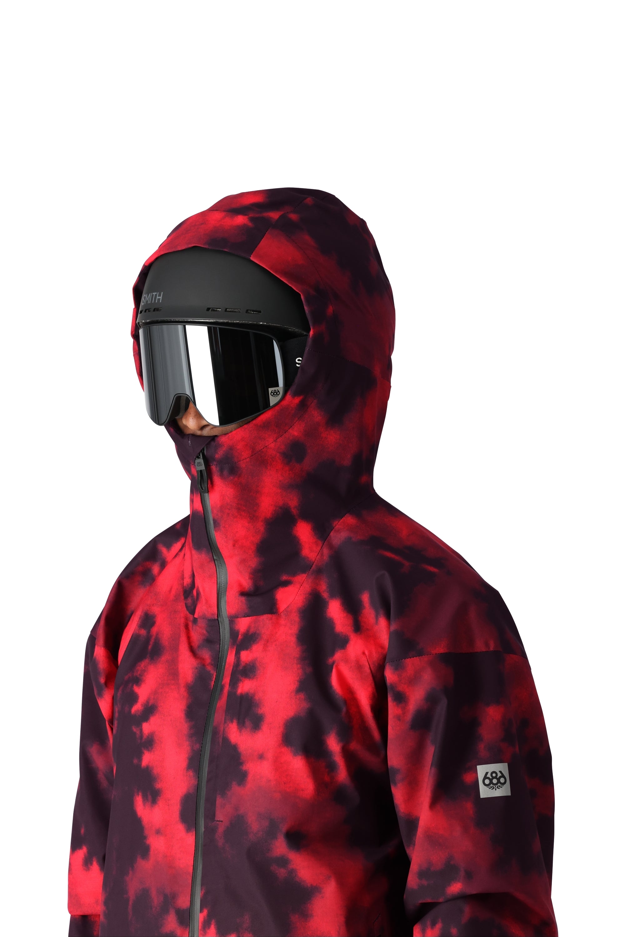 The 686 Gateway Shell Jacket 2025 has a black and red tie-dye pattern with an insulated hood.