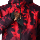 The 686 Gateway Shell Jacket 2025 in red and black tie-dye pattern has an insulated hood.