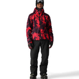 The 686 Gateway Shell Jacket 2025 is red and black with an abstract pattern.