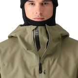 The 686 Gateway Shell Jacket 2025 is showcased in this image, featuring a light brown color with an insulated hood and a front zipper.