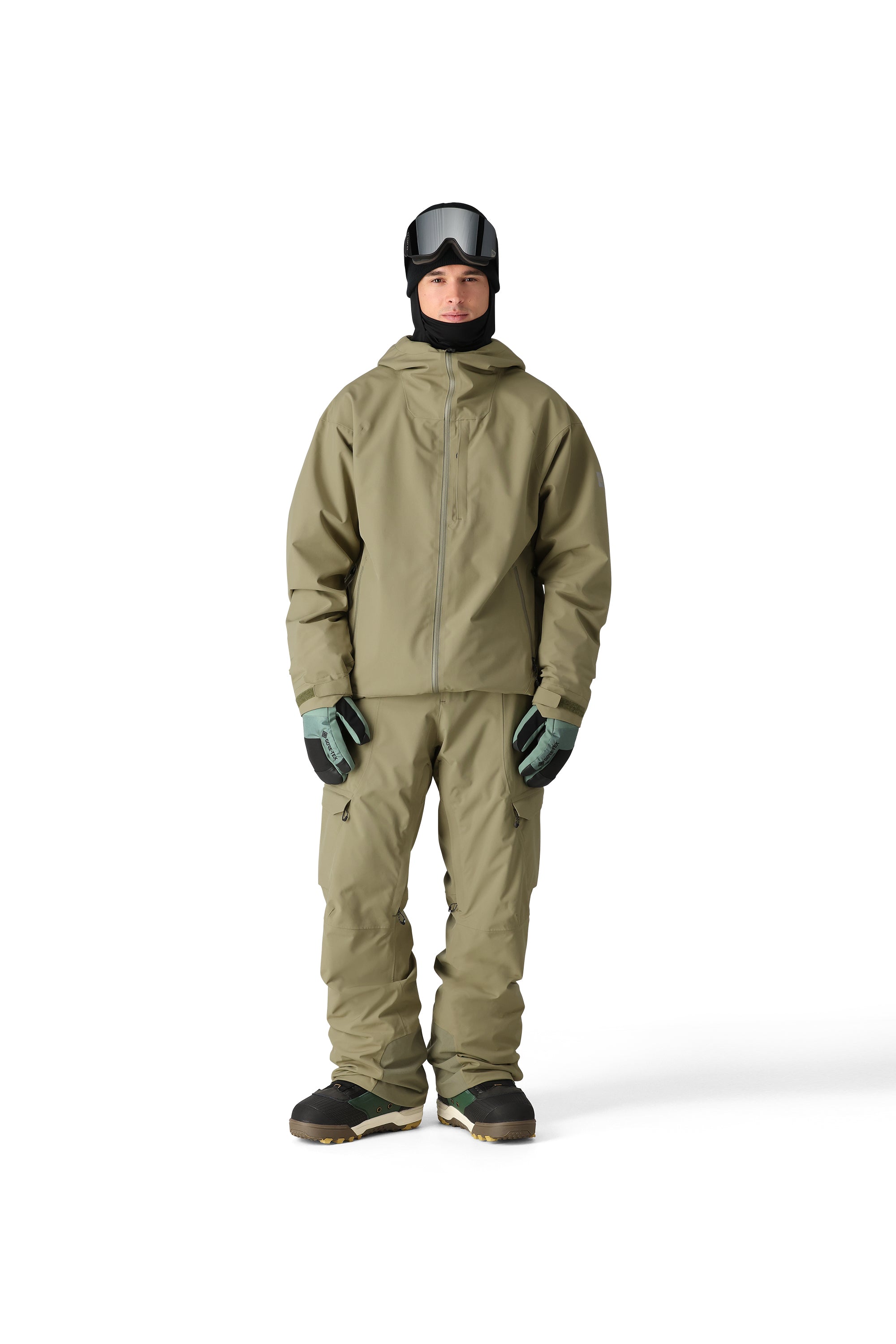 The 686 Gateway Shell Jacket 2025 is primarily khaki green with a black hood and zipper.