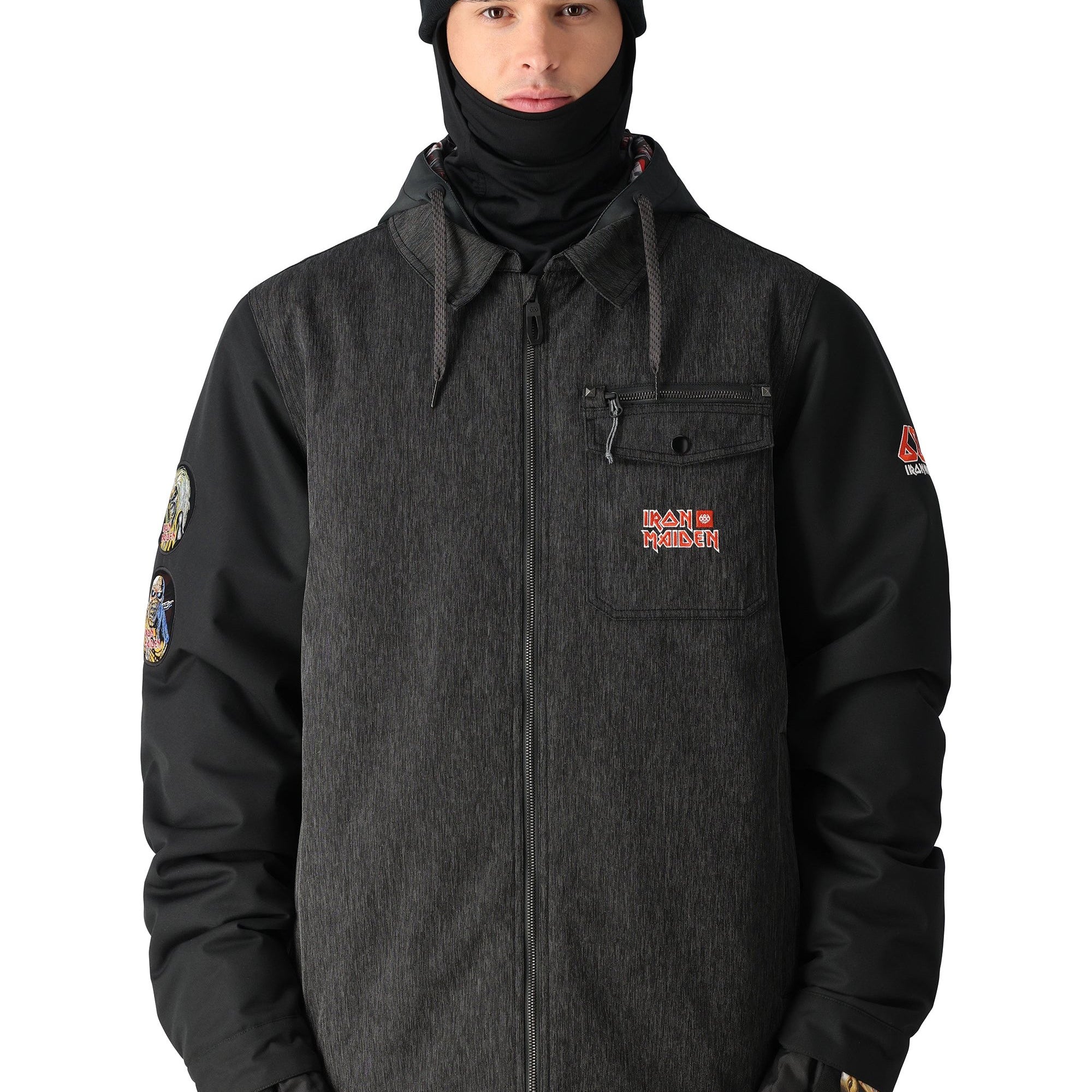 The 686 Iron Maiden Insulated Battle Jacket 2025 is black with an embroidered red and gold Iron Maiden logo on the left chest pocket.