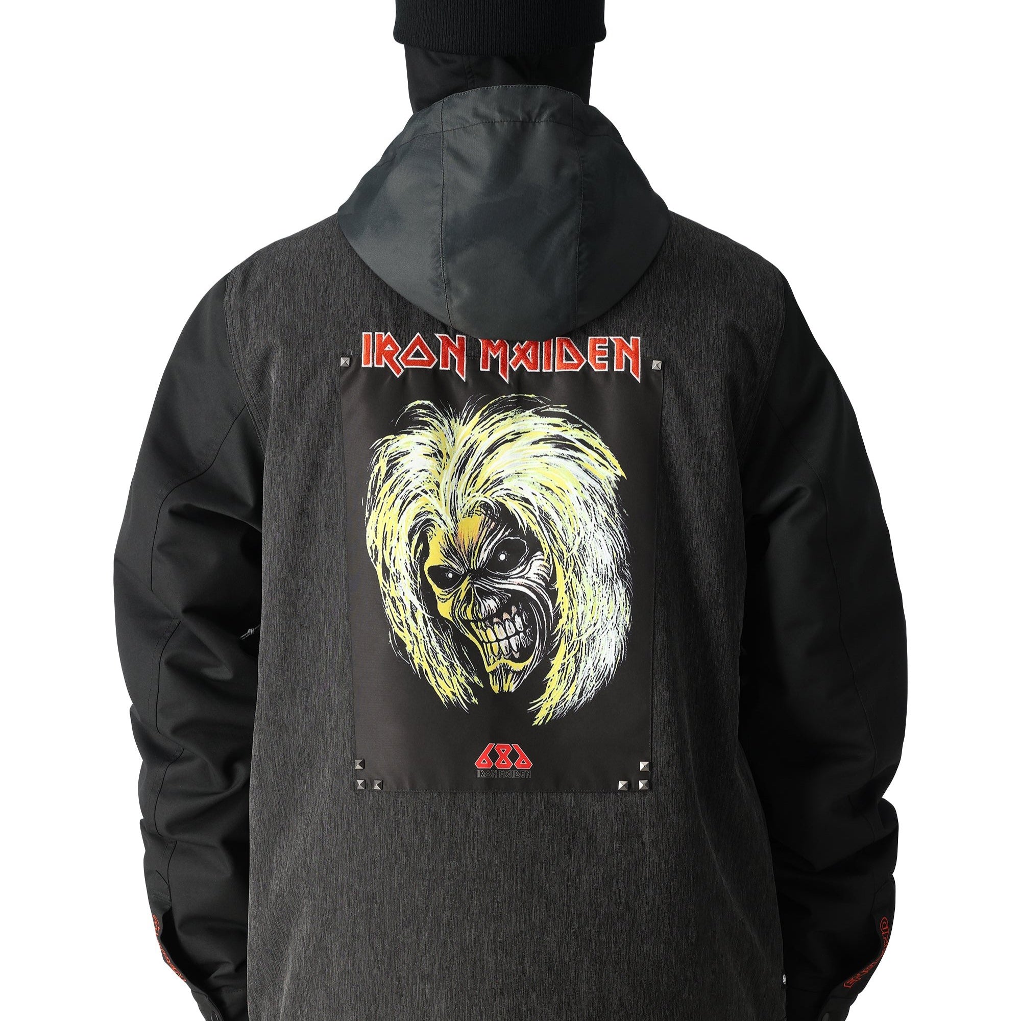 The black 686 Iron Maiden Insulated Battle Jacket features an Iron Maiden logo on the front and has a hood.