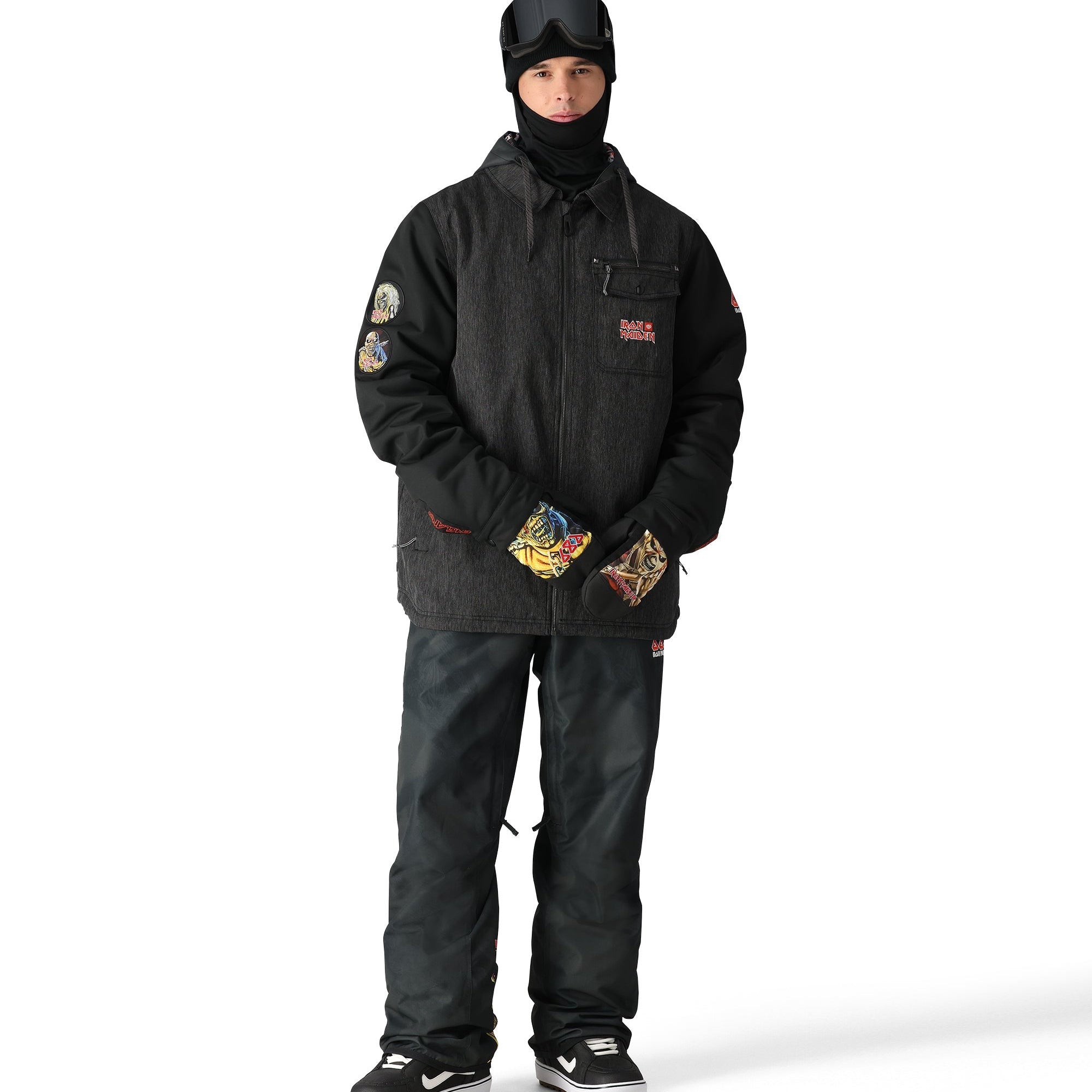 The 686 Iron Maiden Insulated Battle Jacket 2025 has a black front view with an embroidered Iron Maiden logo on the left chest and red accents.