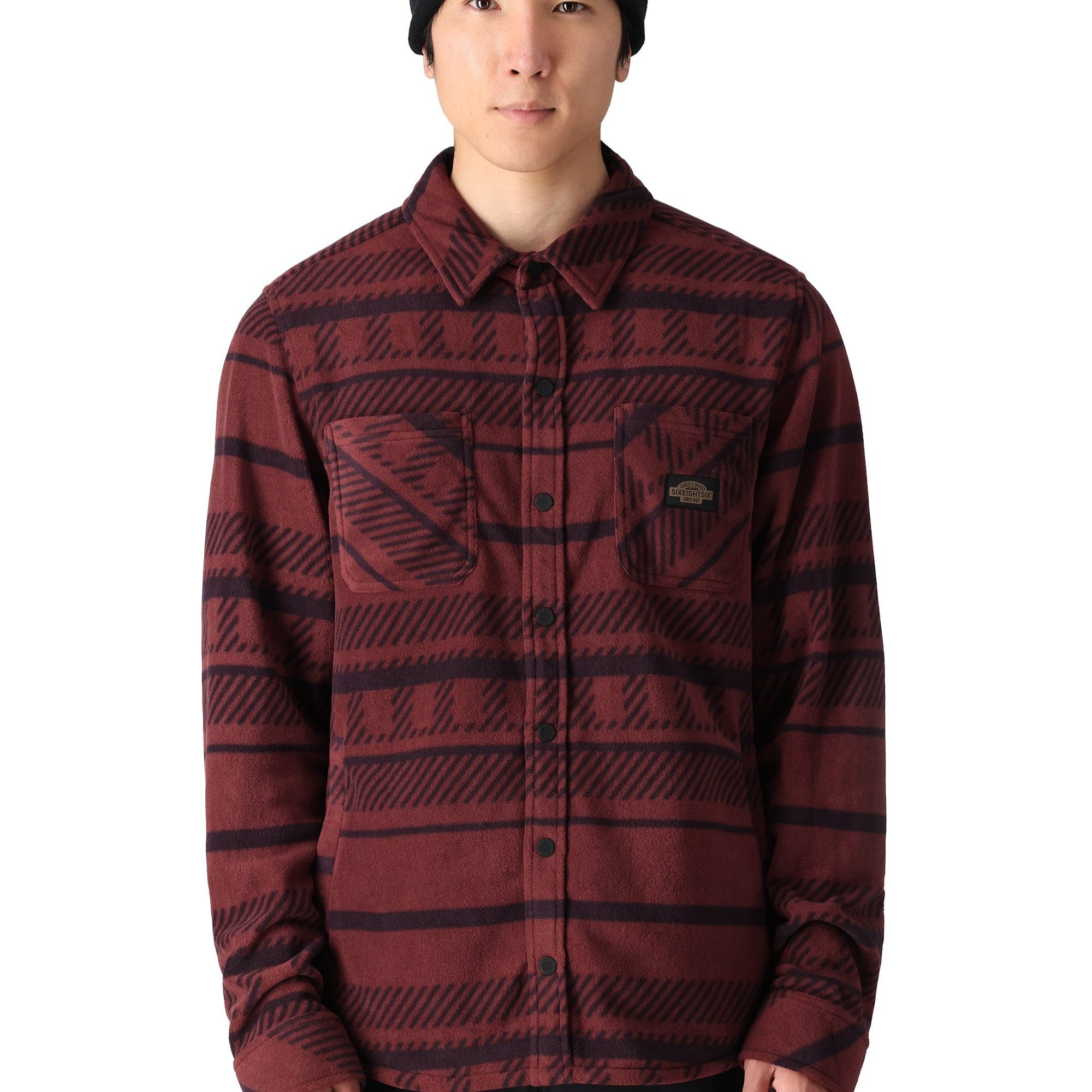 The 686 Men's Sierra Fleece Flannel 2025 is displayed in a red and black plaid pattern.
