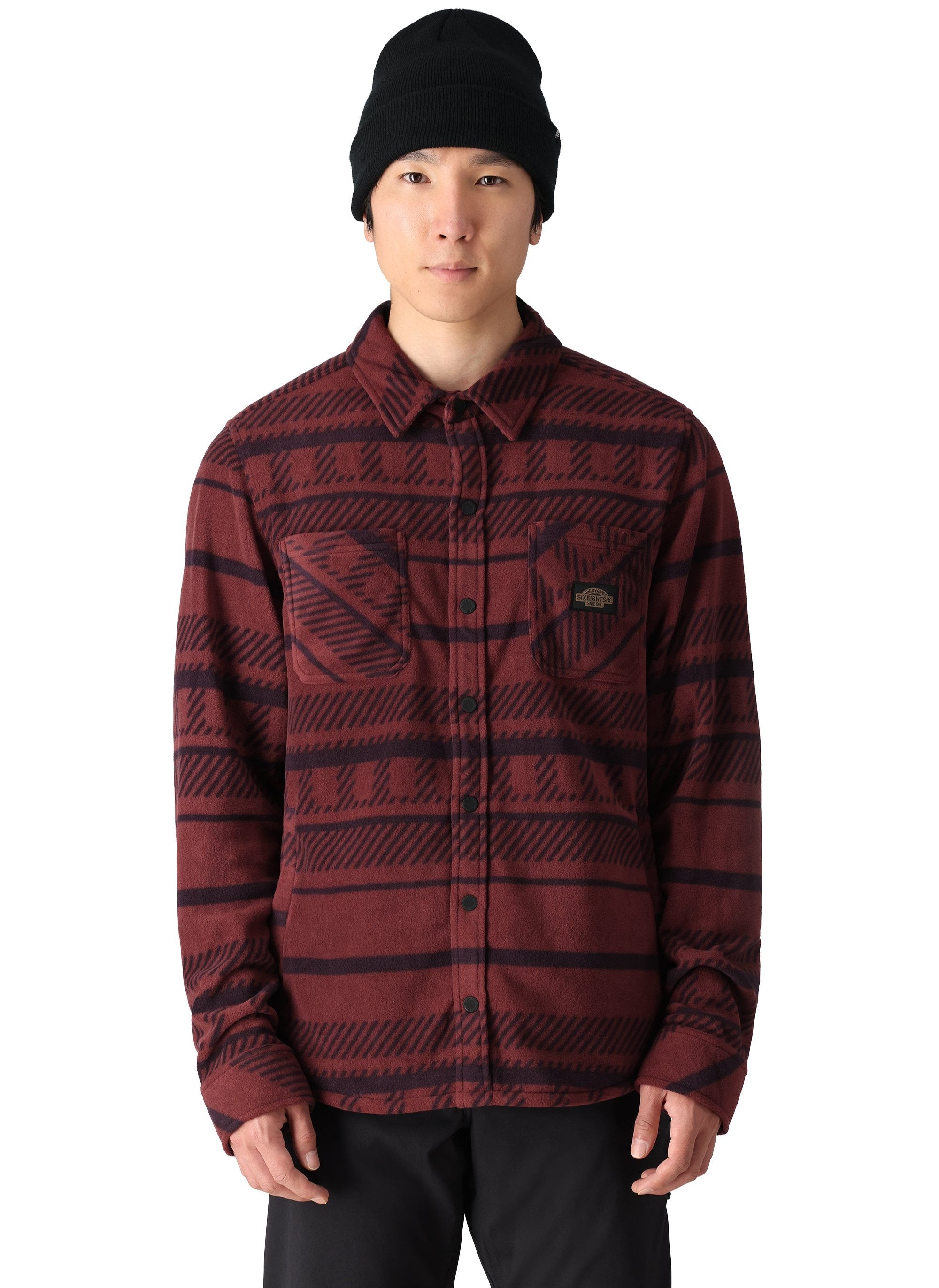 The 686 Men's Sierra Fleece Flannel 2025 is displayed in a red and black plaid pattern.