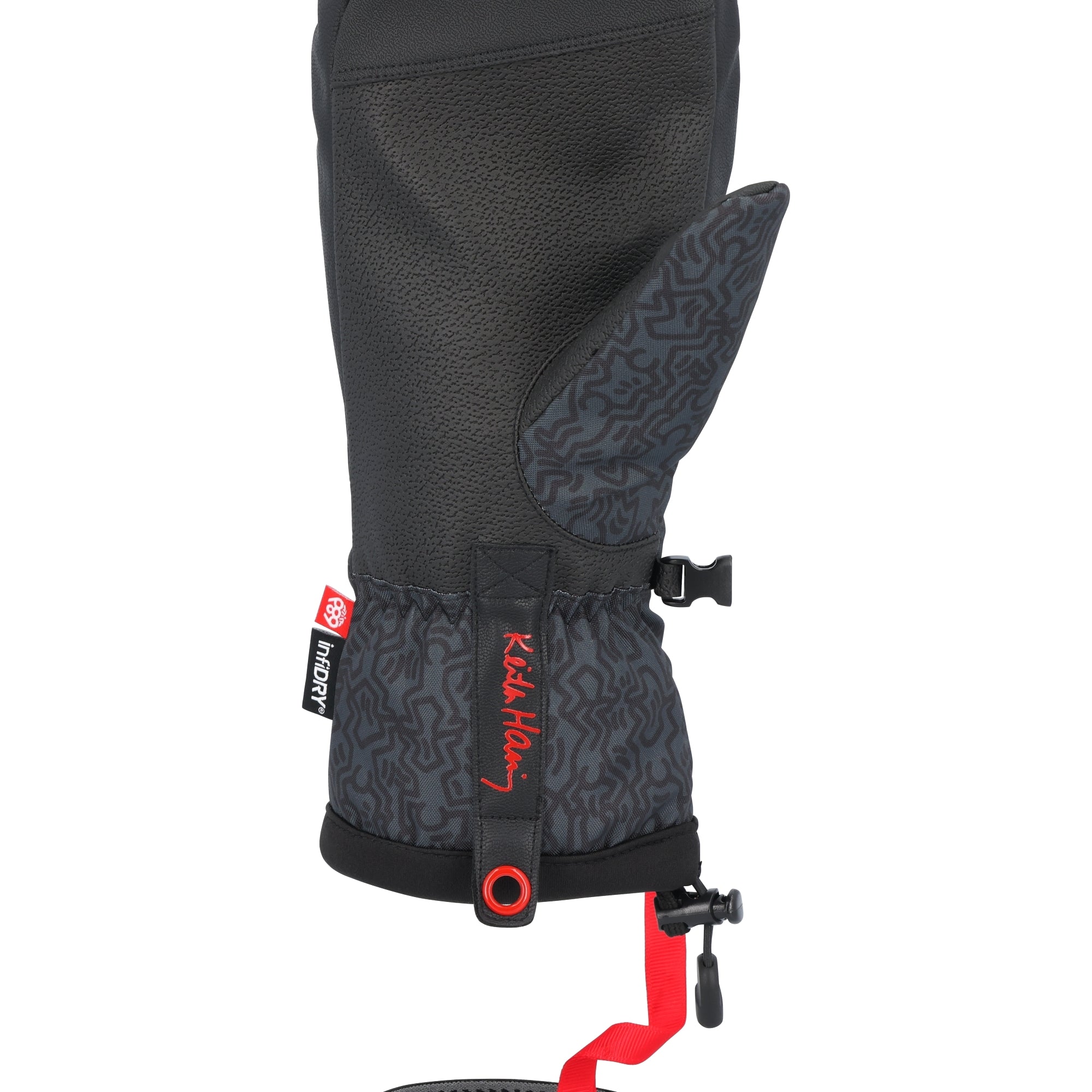 The 686 Men's Team Merino Mitt in black features a distinctive red pattern and a prominent red drawstring on the wrist.