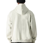 The 686 Men's Vintage Premium Heavyweight Pullover Hoody 2025 is cream-colored with a large front pocket and drawstring hem.