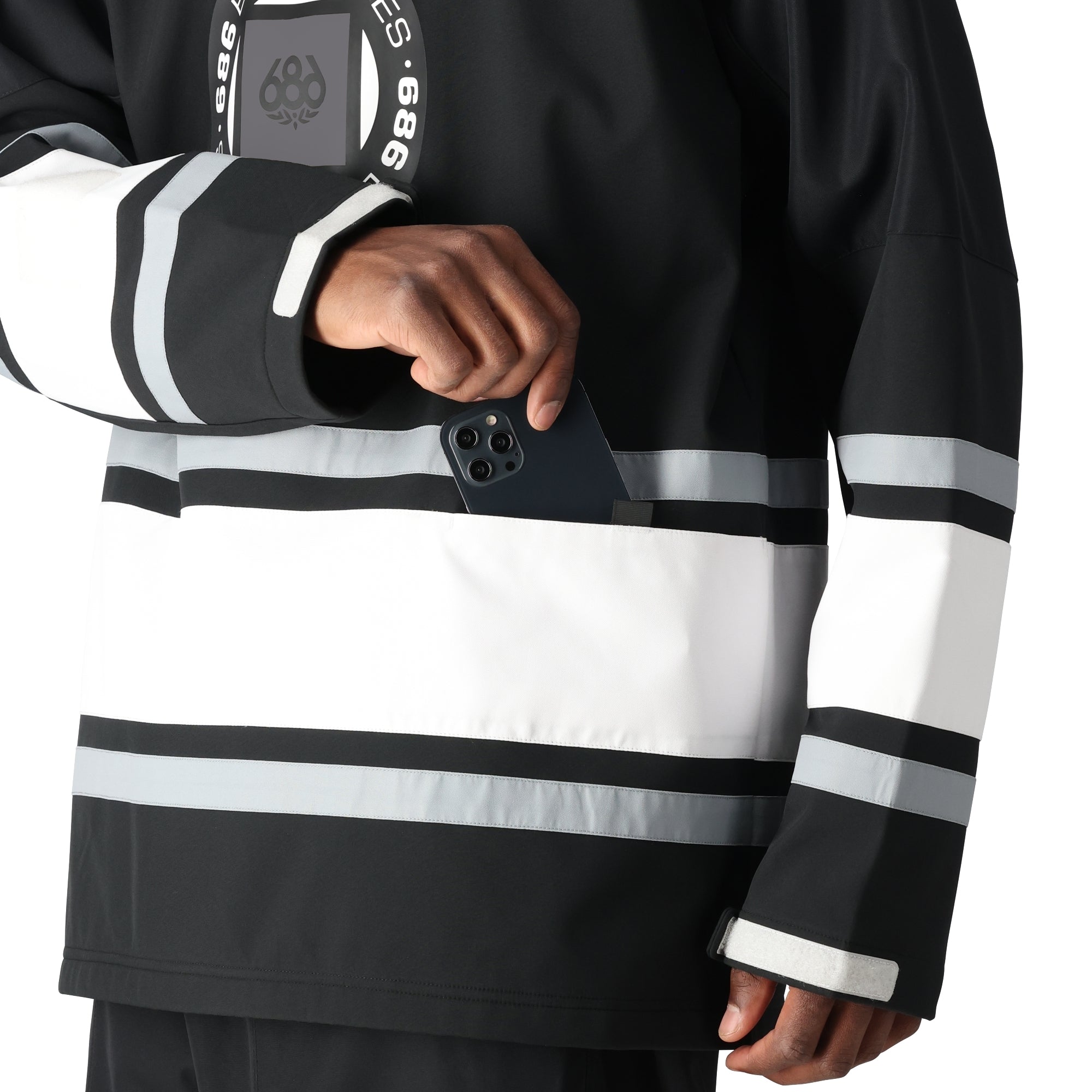 The 686 Waterproof Slapshot Hoody 2025 is black with white stripes and an insulated hood.