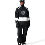 The 686 Waterproof Slapshot Hoody 2025 has a black body with white stripes and grey accents.