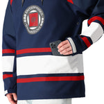 The 686 brand's blue and white Waterproof Slapshot Hoody 2025 has red accents on the shoulders.