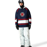 The 686 Waterproof Slapshot Hoody 2025 is navy blue with red and white stripes on the front.