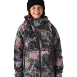 The 686 Girl's Hydra Insulated Jacket features a black base with a pink and gray abstract pattern, a hood, and a zippered front.