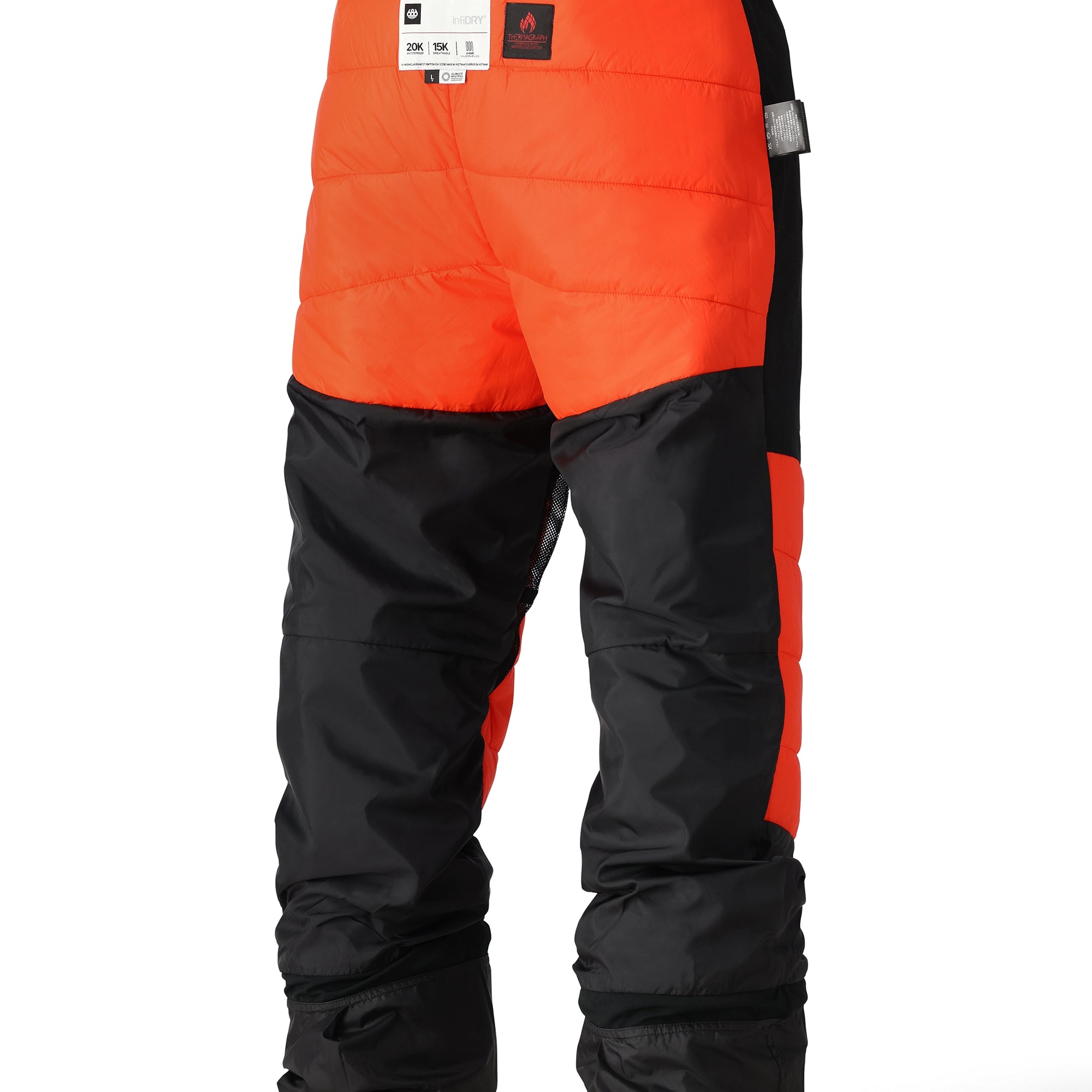 The 686 Quantum Thermagraph Pant in orange and black appears to be modeled on someone wearing it from the back.
