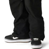 The 686 brand Quantum Thermagraph pant in this image appears to be black with an elastic waistband and zippered pockets.