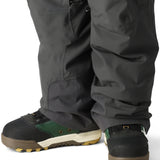 The 686 Men's Quantum Thermagraph Pant 2025 is dark gray with zippered pockets and a black drawstring on the waist.