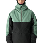 The Renewal Insulated Anorak Jacket by 686 boasts a striking combination of black and sage green hues.