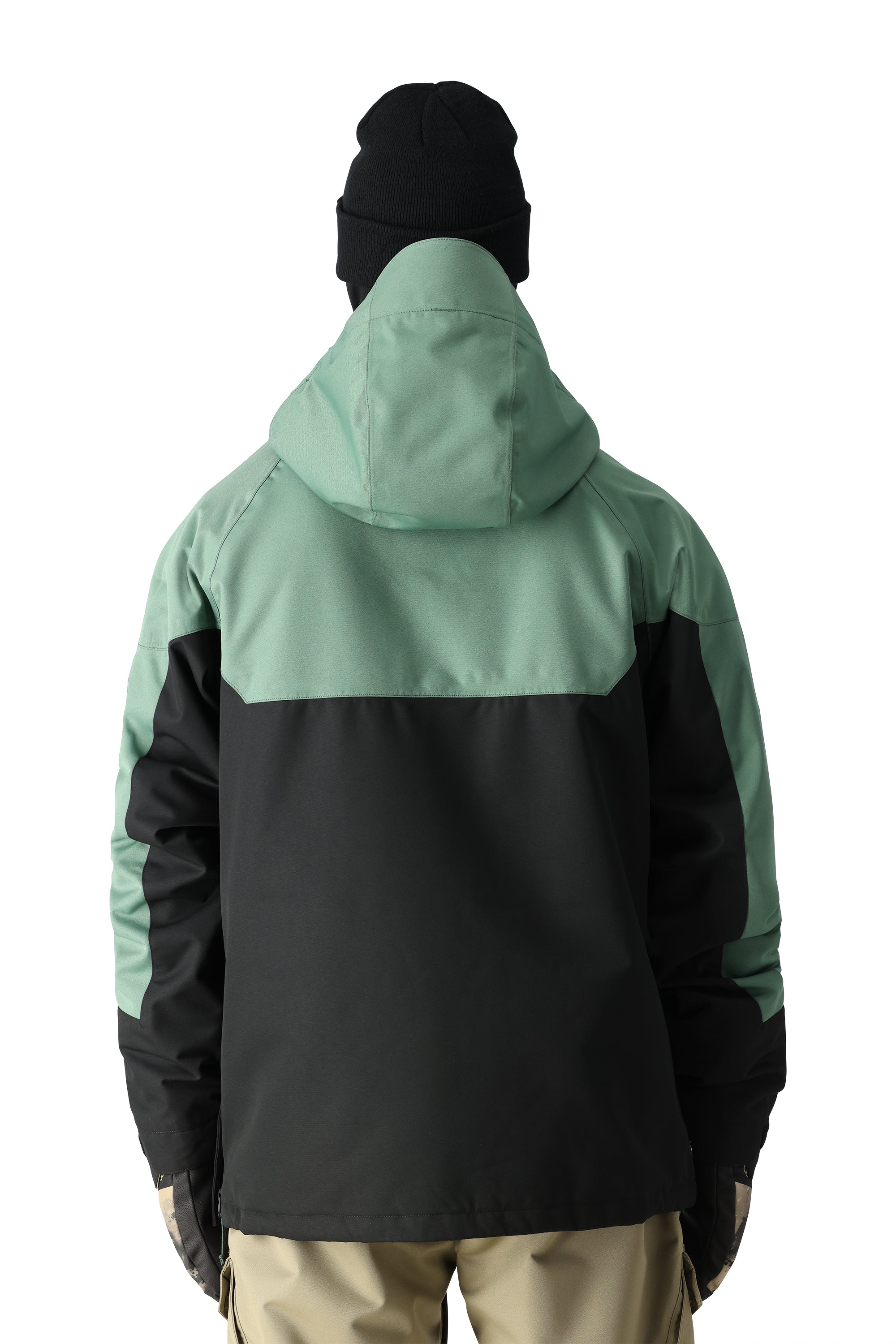 The 686 Renewal Insulated Anorak Jacket in this front view features a black body with mint-green shoulders and hood.