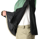 The 686 Renewal Insulated Anorak Jacket 2025 is primarily black with green accents and has a zippered front.