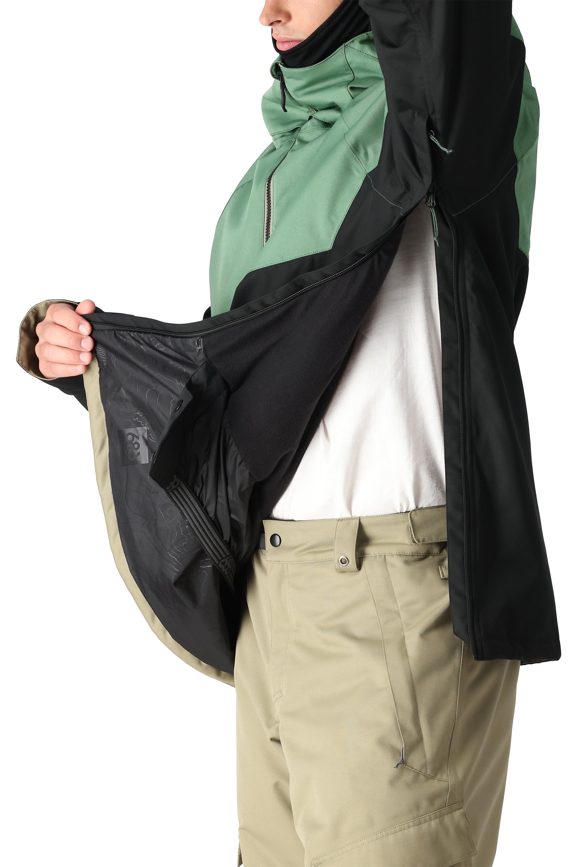 The 686 Renewal Insulated Anorak Jacket 2025 is primarily black with green accents and has a zippered front.