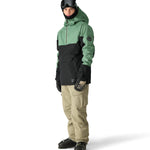 The 686 Renewal Insulated Anorak Jacket 2025 is black and green with an oversized hood.