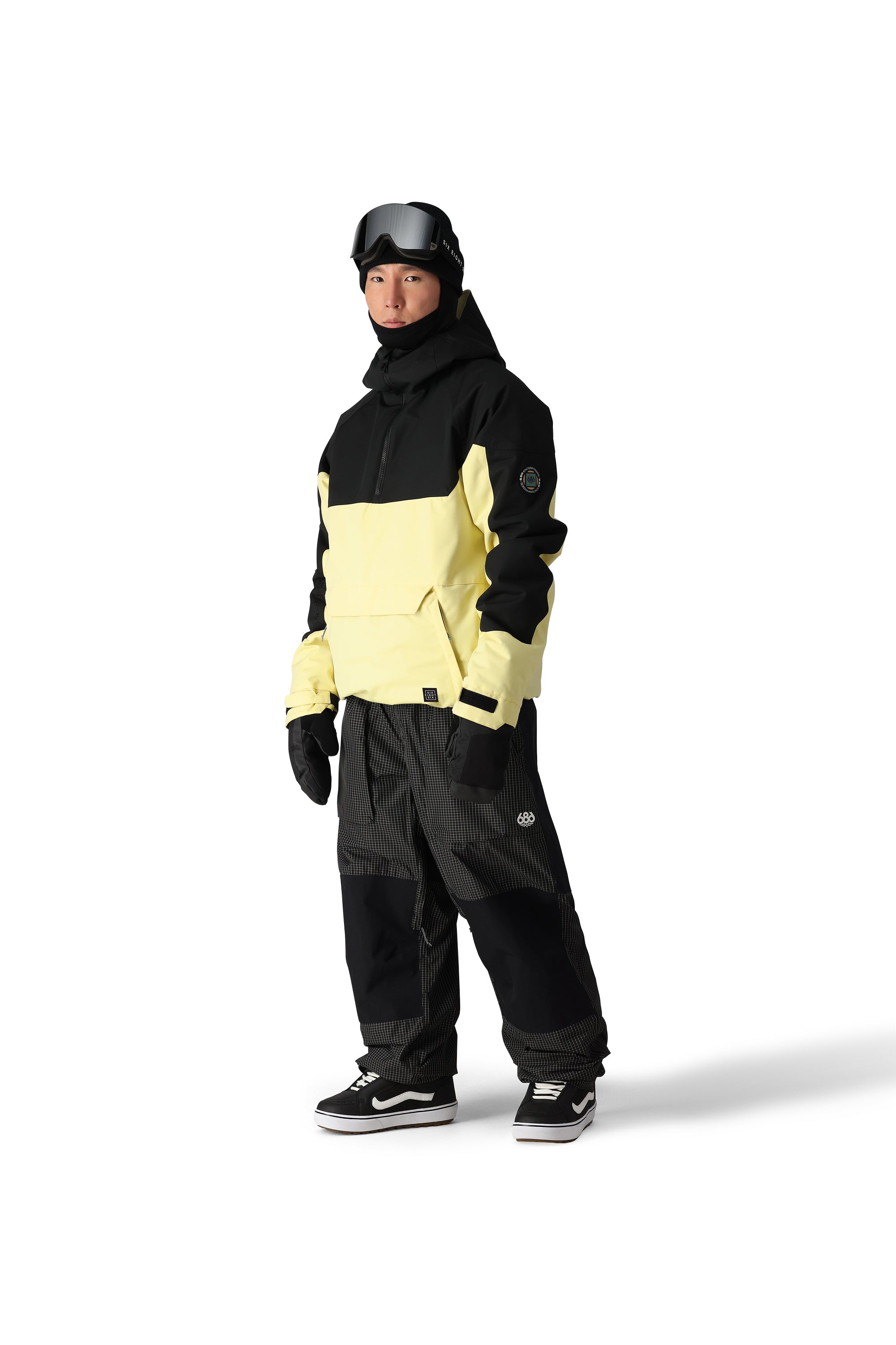 The 686 Renewal Insulated Anorak Jacket 2025, visible in the front view, has a black and yellow color block design with an insulated hood.