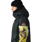 The 686 Renewal Insulated Anorak Jacket 2025 has a black color and showcases an Iron Maiden graphic on the front.