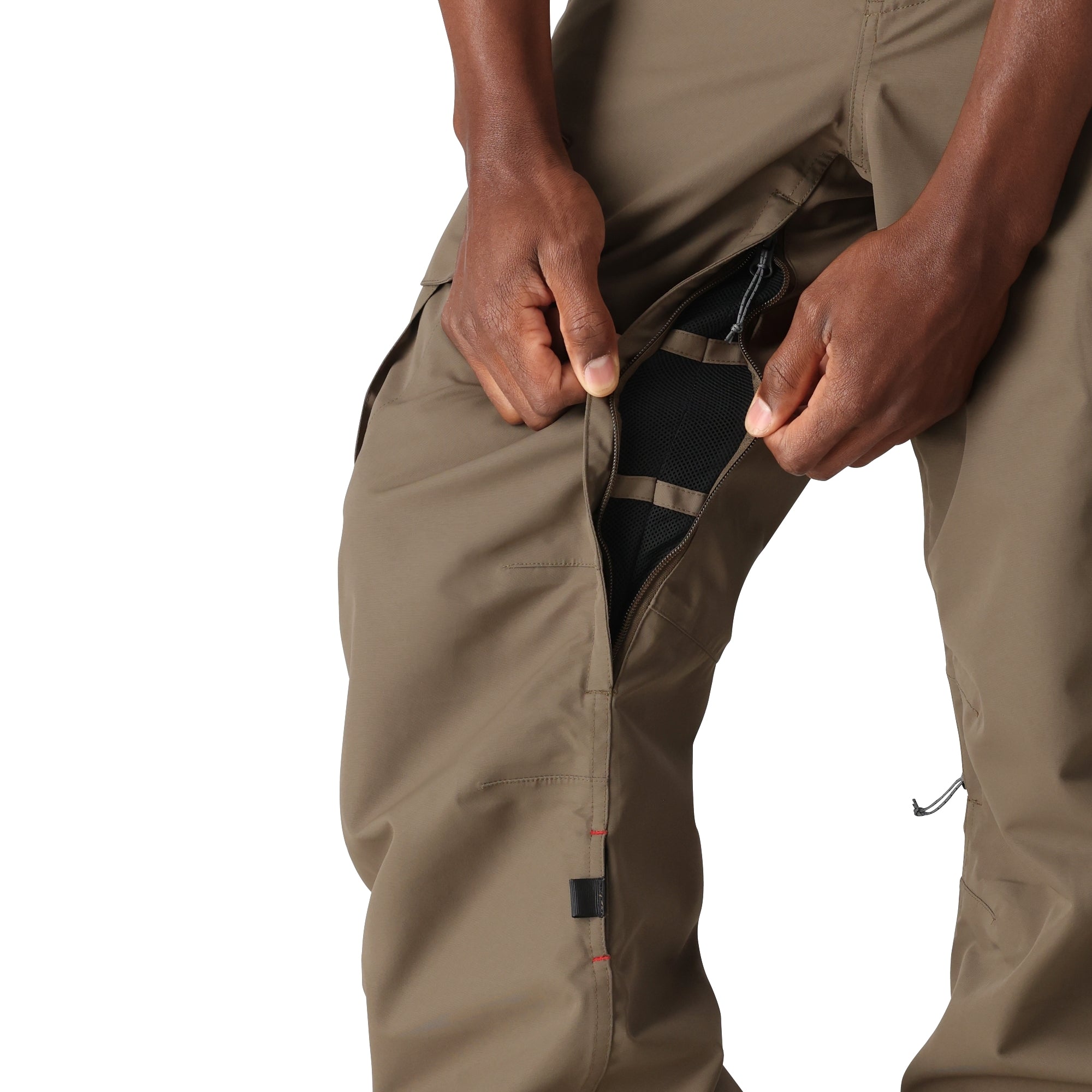 The 686 Men's SMARTY 3-in-1 Cargo Pant in brown features cargo pockets on the thighs and a zippered pocket at the back.