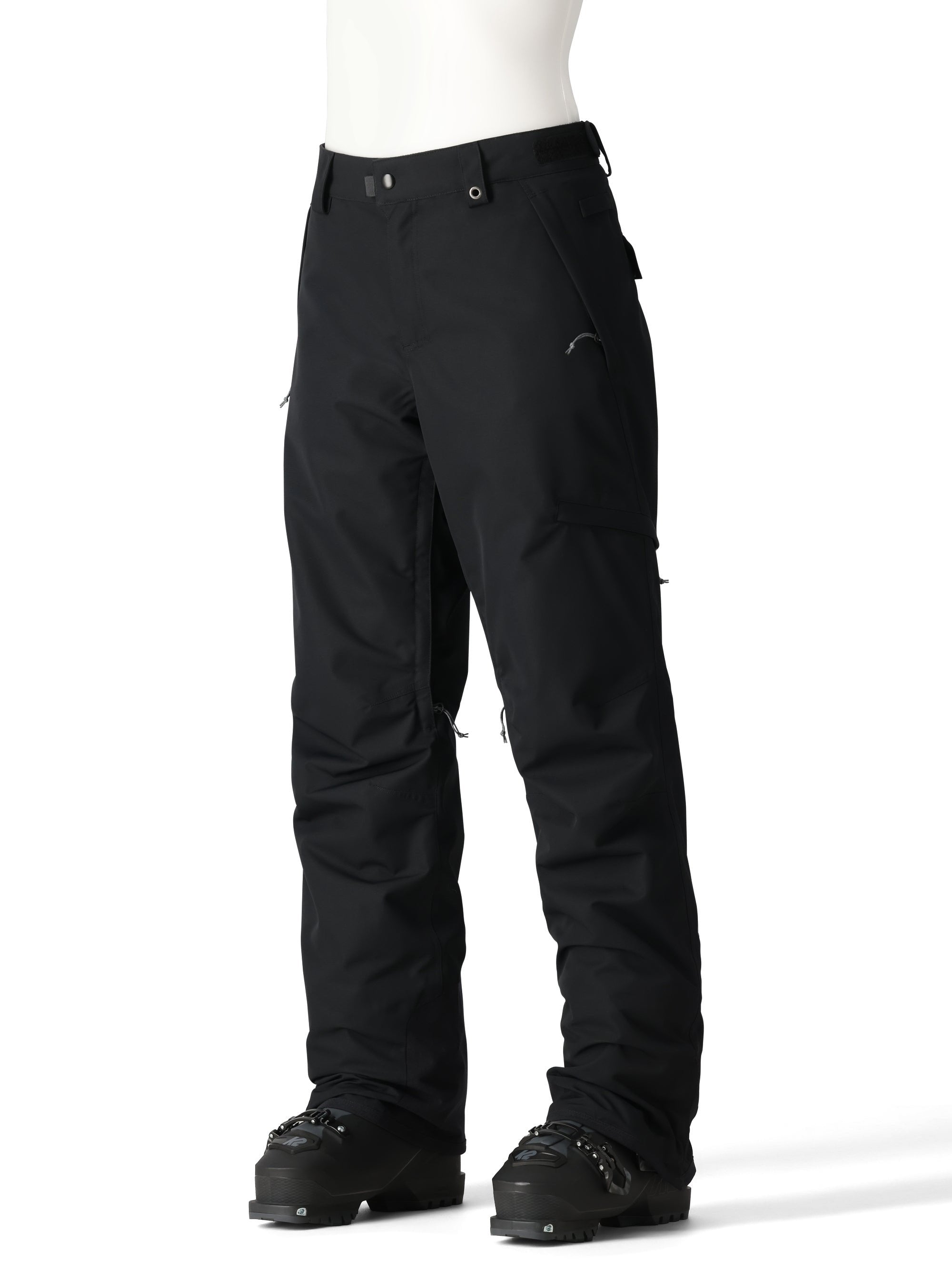 The 686 Women's SMARTY 3-in-1 Cargo Pant in black features a zip-off bottom layer and cargo pockets on both legs.